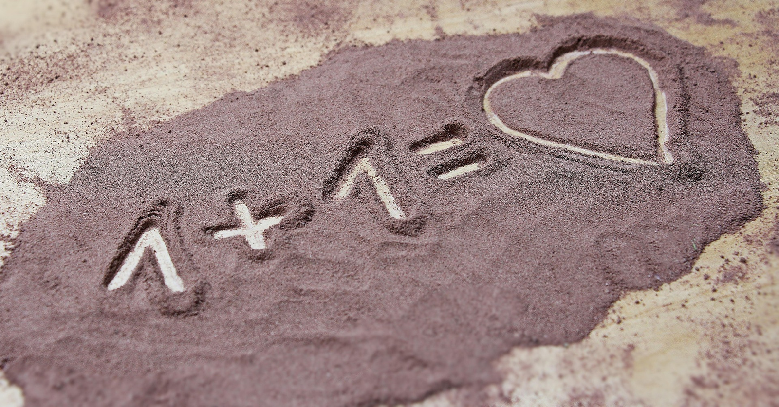 1+1= a heart drawn in powder on a kitchen counter.